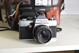 Praktica Super TL2 with Pentacon 50mm f1.8 lens. Sold with a Nissin 300H flash unit, a Weston Master