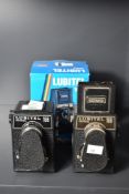 Three Lubitel 166 twin lens reflex medium format camera. One is camera in this collection is still