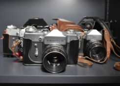 Three Zenit B 35mm cameras, one with a Industar 50mm f3.5 lens, two with Helios 58mm f2 44-2 lens.
