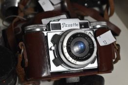 Braun Paxette 35mm camera, with a 45mm f2.8 lens, a Meyer-Optik 100mm f2.8 lens and other