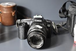 Canon EOS 1000 35mm film camera, with a Sigma Zoom 55-200mm f4-5.6 lens.