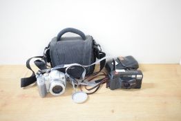 Canon Sure Shot Supreme 35mm camera with a Canon leather case and a Canon Powershot S2 IS digital