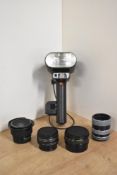 Assortment of camera accessories. An AICO semi fish-eye lens attachment, a Metz G15 flash unit, 2