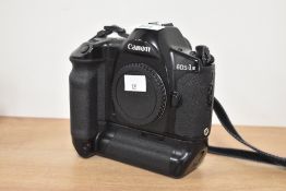 Canon EOS-1N, a professional 35mm camera, with Power Drive Booster E1 vertical grip.