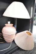 A blue wooden stick table lamp sold along with a ceramic lamp in a ginger jar style both with