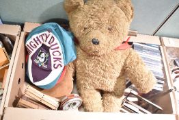 A vintage wool winding machine, a small leather bound portable barometer, three Disney themed