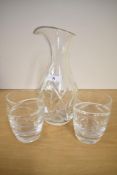 A Waterford for John Roche crystal water jug and two Waterford for Jasper Conran crystal glasses.