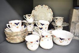 A 20th century CW&Co china tea set, decorated with floral swags, 37 pieces approximately
