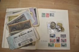 A part filled stamp album, a small selection of assorted coins