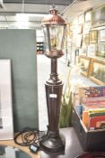 A reproduction table lamp in the form of a street lantern, h75cm