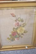 An embroidery of roses in gold and pink on a fawn background with initials MD to lower left hand
