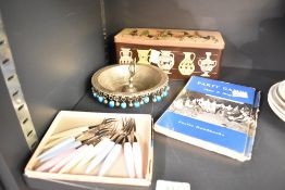 A vintage Middle Eastern medicinal bowl, a set of pickle forks, a book of Party games and a tin