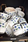 A Mid winter 'Roselle' tea service decorated with geometrical floral patterns, to include cups,