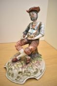 A 20th century ceramic figure of a gentleman smoking a pipe, signed Lucia to base, h28cm