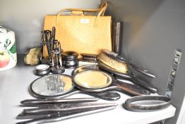 A quantity of ebony brushes and mirrors ect