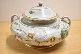 A Doulton Lambeth tureen with cover, decorated with floral designs, impressed and painted mark to