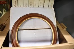 Nine wooden display plate frames in boxes.