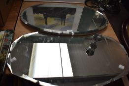 A 20th century oval mirror, w66cm, sold together with 1 other