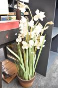 A large faux decorative orchid in pot.