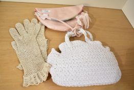 Two vintage handbags with matching open weave gloves, comprising a pastel pink smooth leather semi-