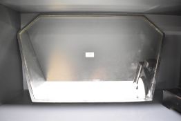 An early 20th century mirror having bevelled edges, L67.5cm