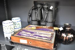 A pair of Prinzlux Extralite 10 x 50 binoculars in carry case, a vintage geometry set in wooden