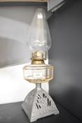 An early 20th century oil lamp, h48cm