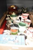 A Dartmouth Devon Glug Jug having dark green glaze, a vintage Wade Art Deco jug, a trio of