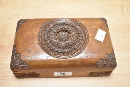 A 20th-century draughts set, stored in a decorative hand-carved wooden box with a hinged lid, 20cm.