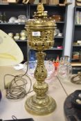 A Victorian Hinks and Sons converted brass oil lamp, of decorative classical-style design, featuring