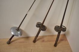 Vintage Leon Paul fencing foil, makers name PAUL visible beneath rust and tarnish, blade bent near