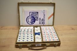 A vintage Mahjong set in case, to include original instructions and all tiles, dice, and counter,