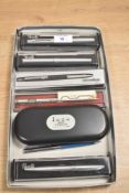 A collection of boxed Fountain, Rollerball, and Ballpoint pens. A Papermate ballpoint, A Penalli