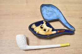 Two 19th-century hand-carved tobacco pipes, to include a Meerschaum example featuring a carved