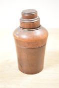 A 19th-century treen container with carved wooden lid, housing a glass apothecary bottle with