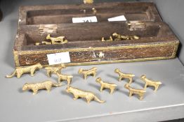 A 20th-century Indian brass Bagh Chal (Moving Tigers) game, consisting of a wooden hinged-lid box