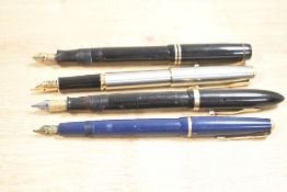 'A selection of four 20th-century fountain pens, to include three Parker pens, such as a Parker