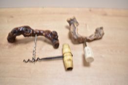 Two vintage grapevine root corkscrews, to include a French example, marked 'Laurent Siret