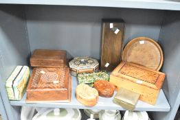 A selection of 20th-century hand-carved wooden boxes, in a variety of different woods, shapes,