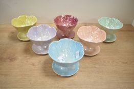 A set of mid 20th-century Beswick 'Harlequin' Pearlescent Lustre sundae dishes, of petal design with
