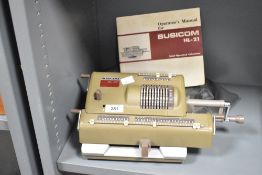 A mid 19th-century Nippon Calculating Machine Corporation Busicom HL-21 calculator, with original