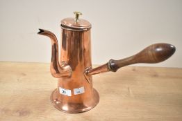 A late 19th/early 20th century copper chocolate pot, featuring a brass-coloured button finial,