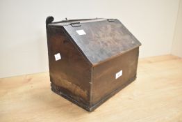 An early 20th-century mahogany coal scuttle/storage box, 27cm, significant damage to the base.