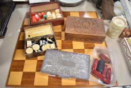 A selection of four 20th-century backgammon sets and checkers with dice, in a variety of decorated