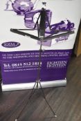 Black metal folding and extendable music stand, currently 130cm in height, with the ability to