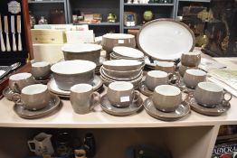 A 20th-century Denby stoneware 'Grey Stone' dinnerware set, to include nine cups and saucers, bowls,