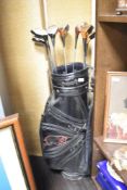 A selection of Dunlop and Ping golf clubs with a Ben Hogan driver in Hippo bag