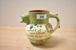 A 1902 C.H. Branham of Barnstaple 'motto ware' art pottery fish jug, featuring a distinctive fish-