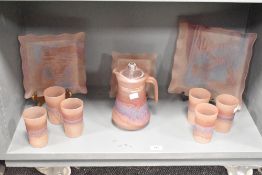 A frosted glass pitcher decorated in purple and blue iridescent patterns, h21cm, sold together