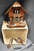 A 20th-century German Anton Schneider Original Black Forest cuckoo clock with weights, designed in
